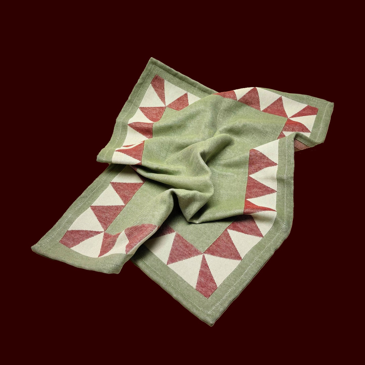 earthy green cotton dish towel / tea towel with geometric border pattern, made in portugal, designed in sweden